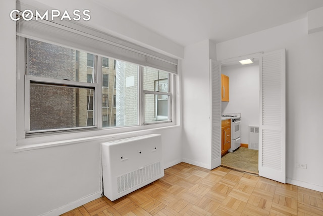 69 W 9th St Unit 8H, New York City, NY 10011 - unfurnished room with heating unit and baseboards
