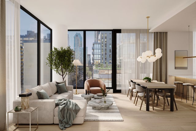 interior space with expansive windows and light wood-type flooring