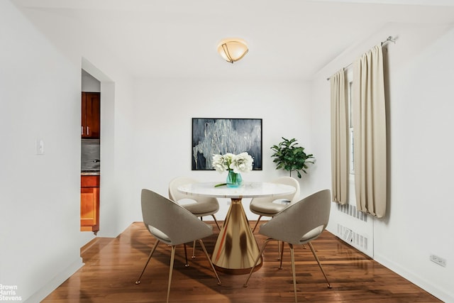 3050 Fairfield Ave Unit 8B, New York City, NY 10463 - dining area with wood finished floors and radiator heating unit