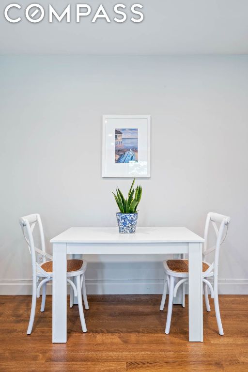 dining area with hardwood / wood-style floors