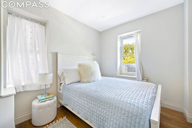 bedroom featuring dark hardwood / wood-style flooring