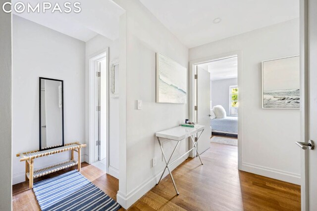 corridor featuring hardwood / wood-style flooring