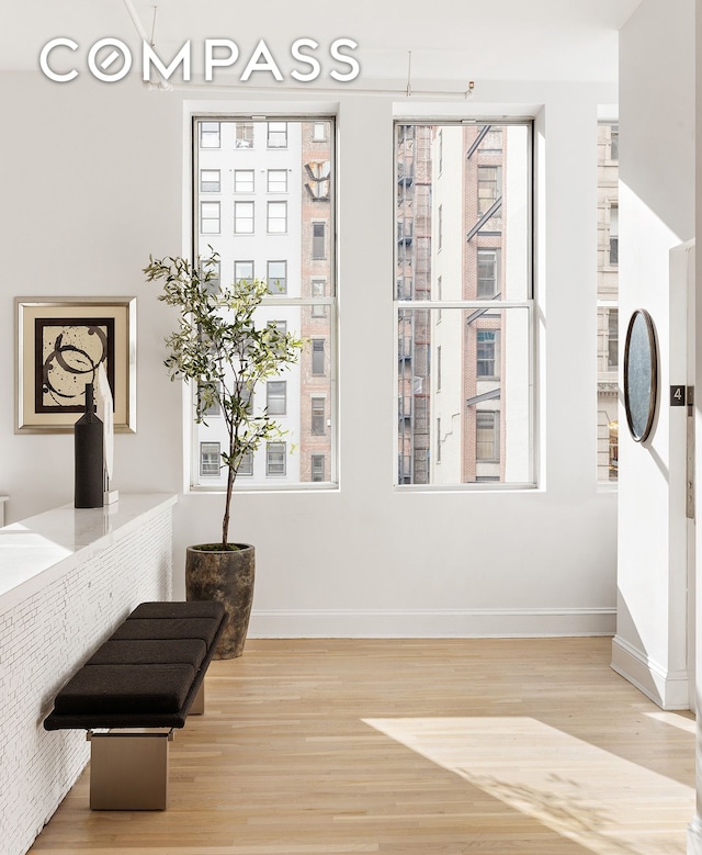 sitting room featuring wood finished floors and baseboards