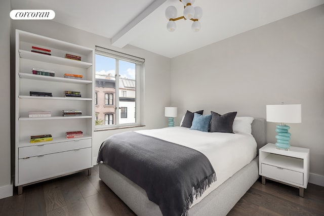 bedroom featuring a chandelier, dark hardwood / wood-style floors, and beam ceiling