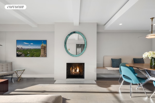 living room featuring hardwood / wood-style flooring and beamed ceiling