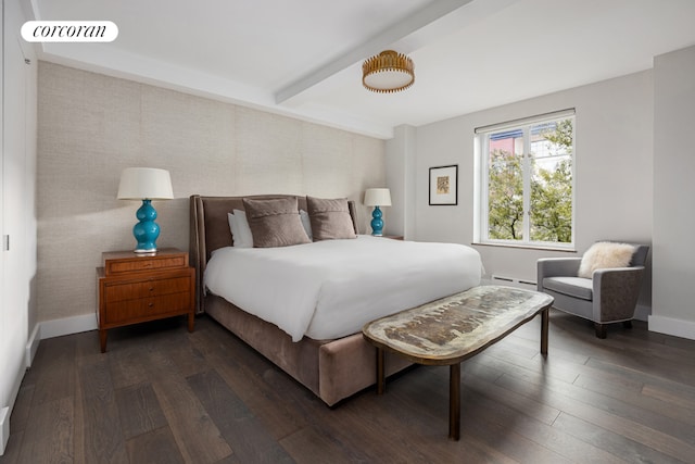 bedroom featuring dark hardwood / wood-style flooring and beam ceiling