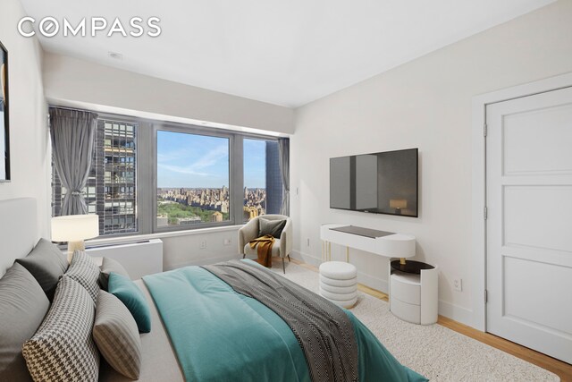 bedroom with hardwood / wood-style flooring