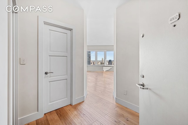 hallway featuring light hardwood / wood-style flooring