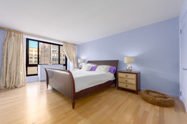 bedroom with light wood-type flooring