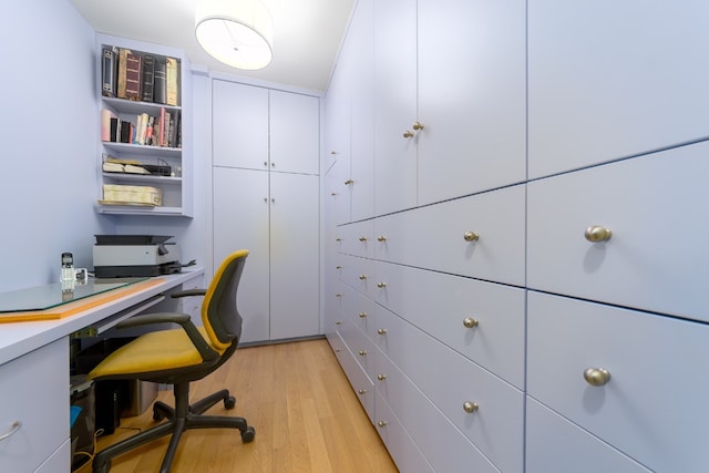 office with light hardwood / wood-style flooring