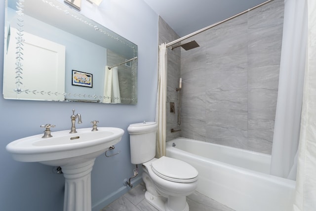 bathroom featuring toilet and shower / tub combo with curtain