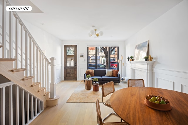 interior space featuring light hardwood / wood-style flooring and a notable chandelier