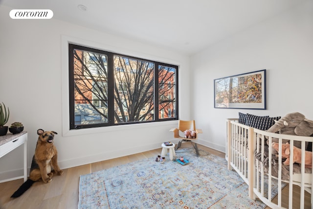 bedroom with wood-type flooring