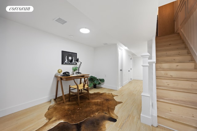 stairs with hardwood / wood-style flooring