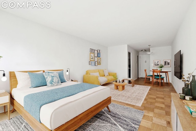 bedroom featuring parquet flooring