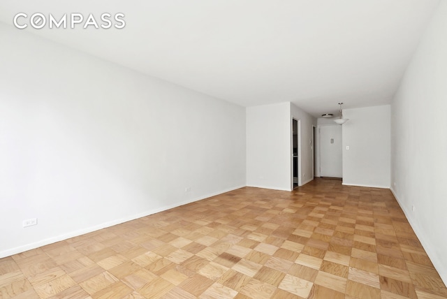 empty room with baseboards