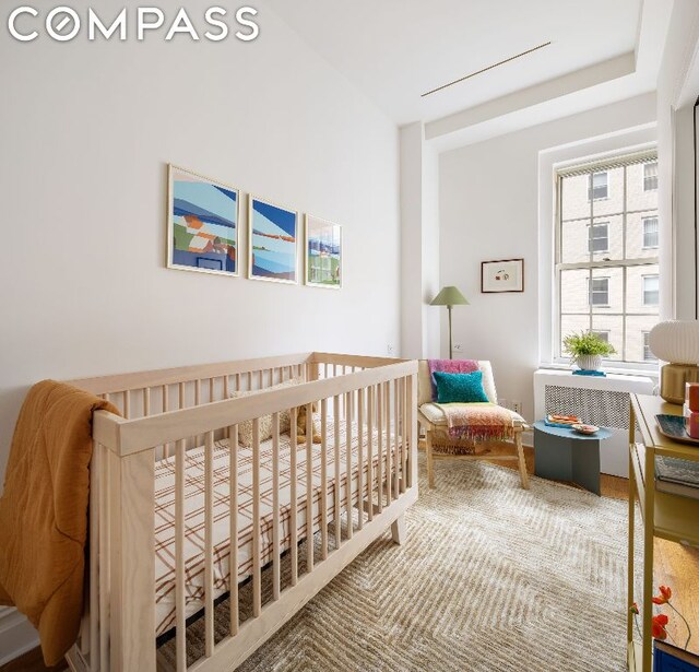 bedroom featuring a crib