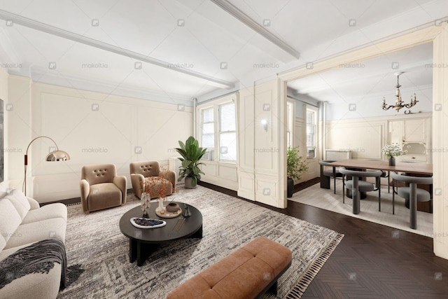 living room with a notable chandelier and a decorative wall