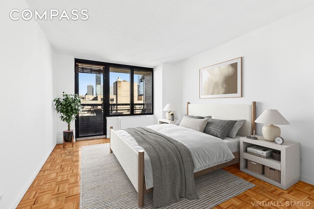 bedroom with light parquet floors