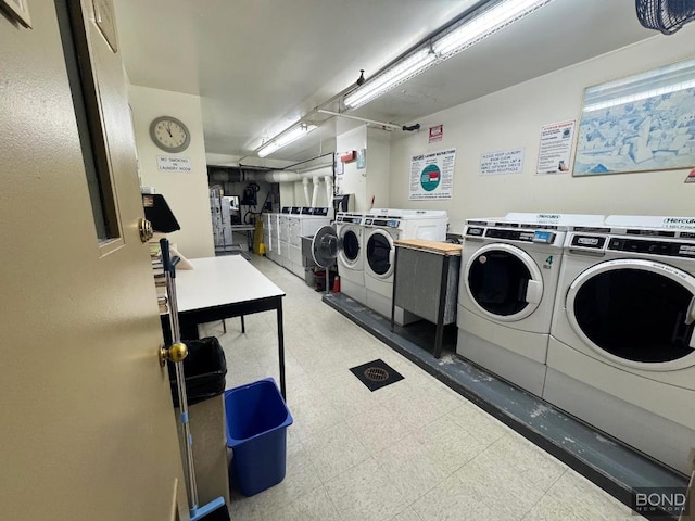 washroom with washing machine and clothes dryer