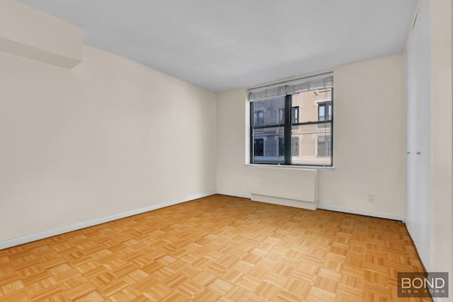 spare room featuring light parquet flooring