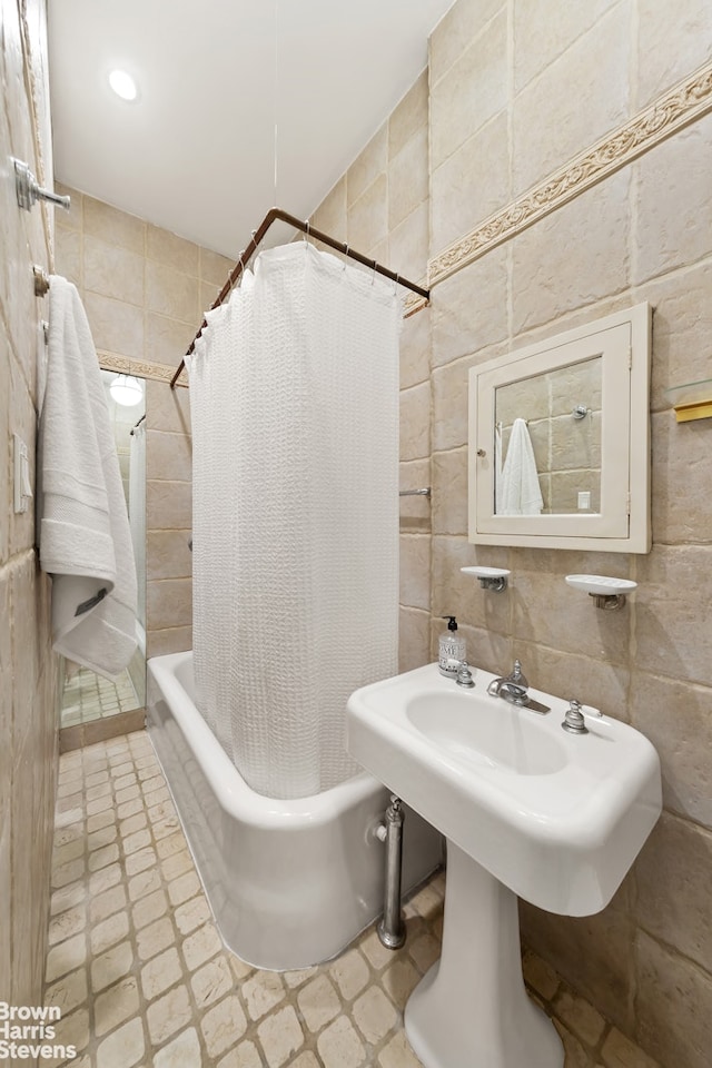 bathroom featuring shower / tub combo, tile walls, recessed lighting, and tile patterned floors