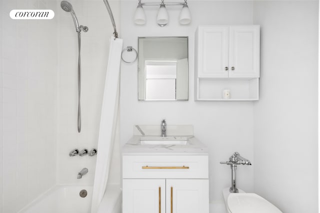 bathroom featuring vanity and shower / bathtub combination with curtain