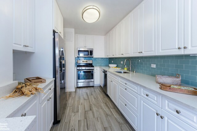 dining space featuring radiator heating unit and light hardwood / wood-style floors