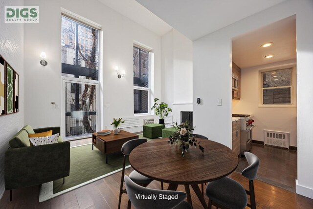 unfurnished living room featuring dark wood-type flooring