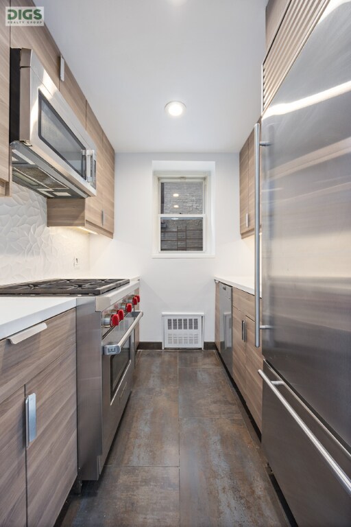 spare room featuring an AC wall unit, dark wood-type flooring, and radiator heating unit