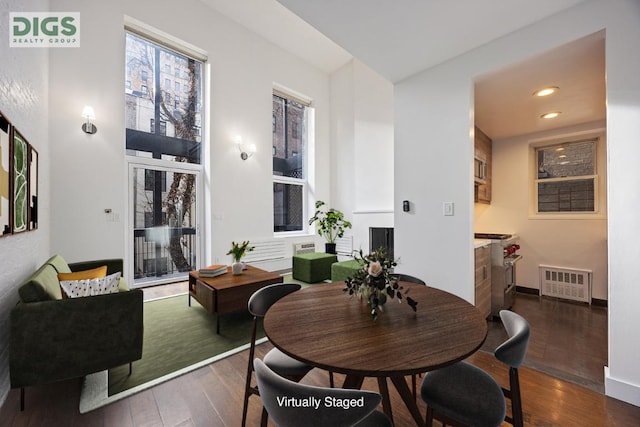 dining space featuring dark hardwood / wood-style floors