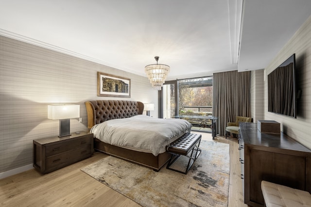 bedroom featuring wallpapered walls, baseboards, light wood finished floors, and ornamental molding