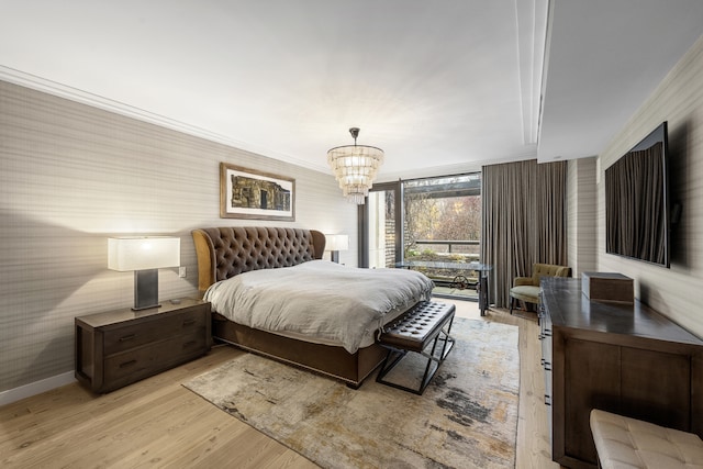 90 Furman St Unit N210, New York City, NY 11201 - bedroom featuring light wood finished floors, a chandelier, crown molding, and wallpapered walls