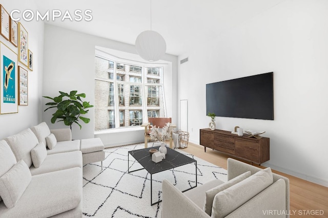 living room with light hardwood / wood-style floors