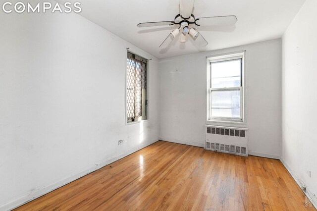 interior space with an inviting chandelier and wood-type flooring