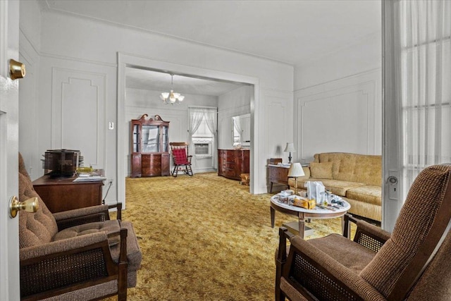 living room with carpet flooring and an inviting chandelier