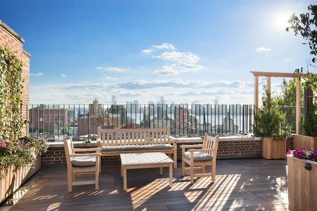 deck featuring an outdoor living space and a water view