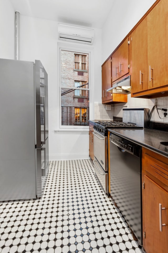 kitchen featuring freestanding refrigerator, black dishwasher, baseboards, under cabinet range hood, and a wall mounted AC