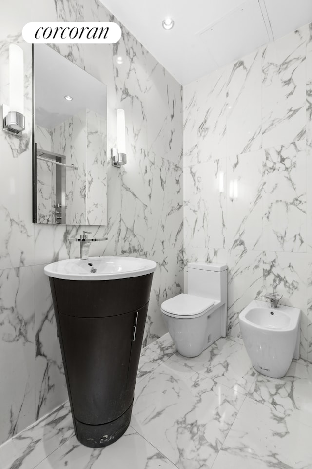 bathroom with vanity, stone wall, toilet, and recessed lighting