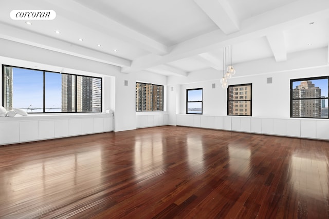 unfurnished living room featuring recessed lighting, visible vents, beam ceiling, and hardwood / wood-style floors