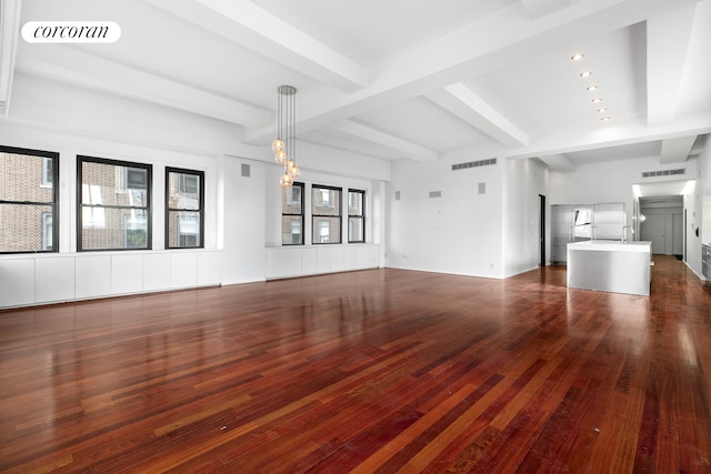 unfurnished living room featuring beam ceiling, visible vents, and dark wood-style flooring