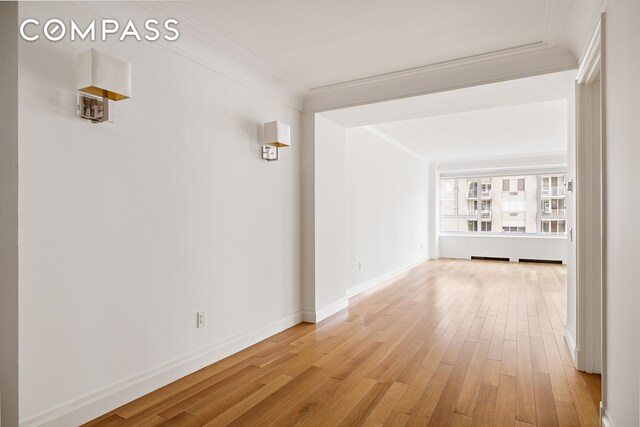 200 E 66th St Unit D1203, New York City, NY 10065 - hall featuring light wood-style flooring, crown molding, and baseboards