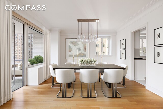 200 E 66th St Unit D1203, New York City, NY 10065 - dining space with light wood-style flooring, baseboards, and ornamental molding