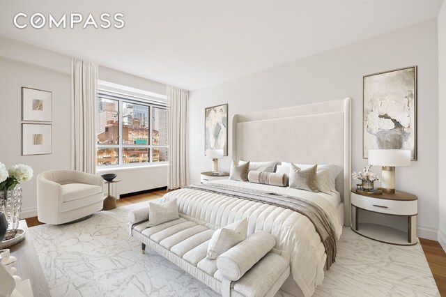 200 E 66th St Unit D1203, New York City, NY 10065 - bedroom featuring baseboards and wood finished floors