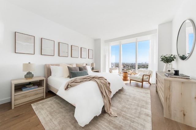 bedroom with hardwood / wood-style floors