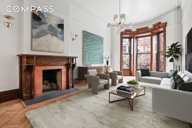 sitting room featuring ornamental molding, a chandelier, baseboards, and a fireplace with flush hearth