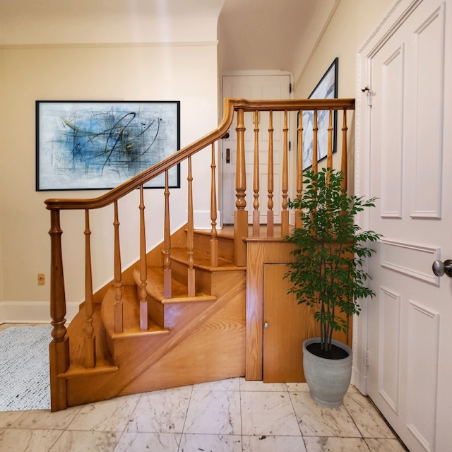 stairs with marble finish floor