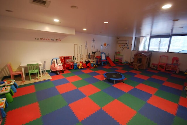 recreation room featuring recessed lighting, carpet, and visible vents