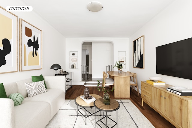 living room with dark hardwood / wood-style flooring and crown molding