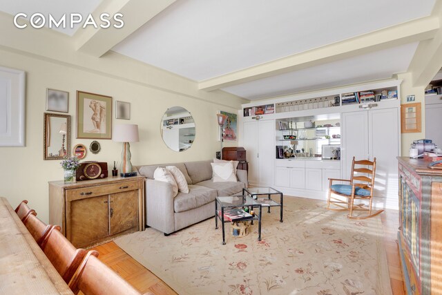 living room with beam ceiling